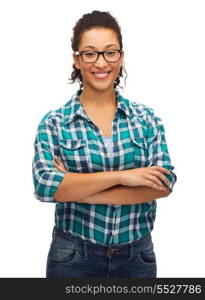 hapiness and people concept - smiling young african american woman in eyeglasses with crossed arms