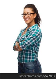 hapiness and people concept - smiling young african american woman in eyeglasses with crossed arms