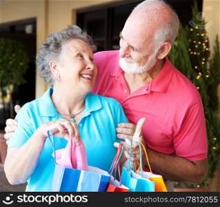 Happily married senior couple on a shopping strip together.