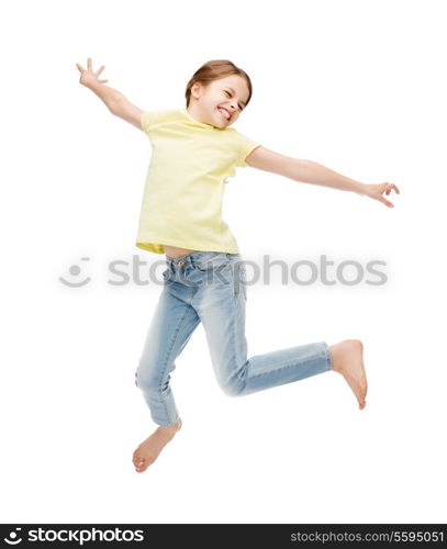 happiness, activity and child concept - smiling little girl jumping