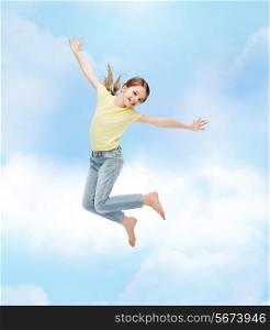 happiness, activity and child concept - smiling little girl jumping
