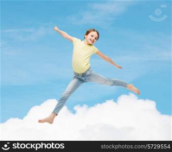happiness, activity and child concept - smiling little girl jumping