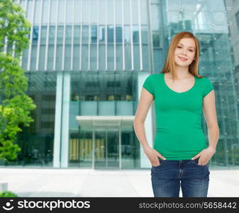 happiness, advertisement, business, education and people concept - smiling teenage girl in casual clothes over campus background