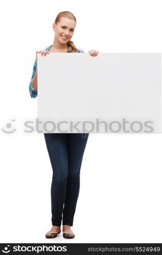 happiness, advertising and people concept - smiling young woman with white blank board