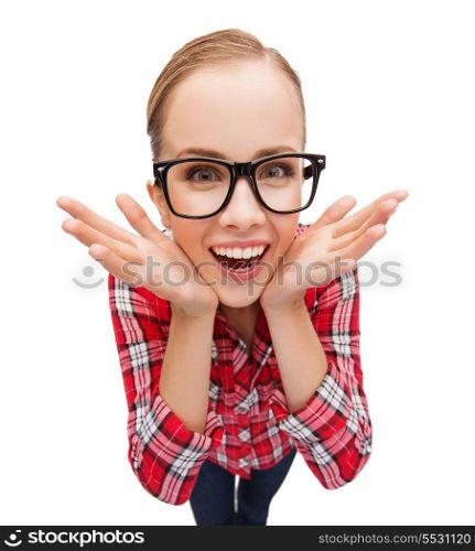 happiness and gesture concept - smiling teenager in eyeglasses screaming