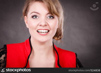 Happiness and joy. Smiling positive young woman in red. Blonde charming elegant lady on dark background.. Happy joyful elegant woman in red.