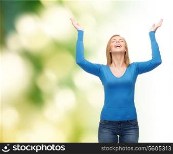 happiness and people concept - laughing young woman with closed eyes waving hands