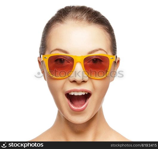 happiness and people concept - portrait of happy amazed teenage girl in sunglasses. happy amazed teenage girl in sunglasses