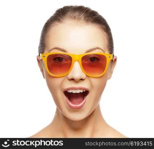 happiness and people concept - portrait of happy amazed teenage girl in sunglasses. happy amazed teenage girl in sunglasses