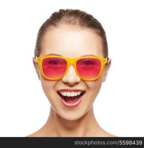 happiness and people concept - portrait of happy teenage girl in shades