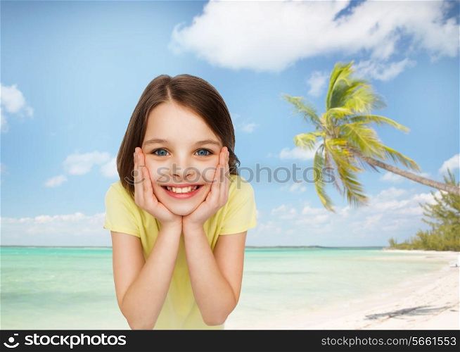 happiness and people concept - smiling little girl holding head over white background