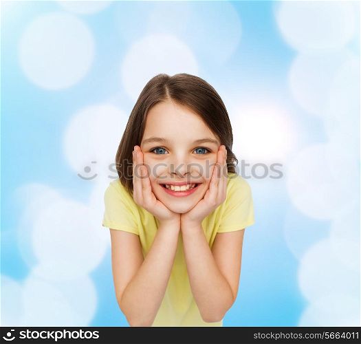 happiness and people concept - smiling little girl holding head over white background