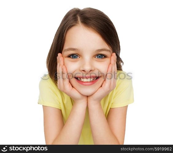 happiness and people concept - smiling little girl holding head over white background. smiling little girl over white background