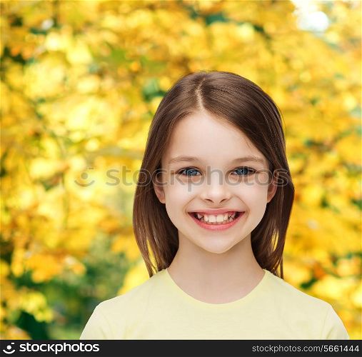 happiness and people concept - smiling little girl over white background