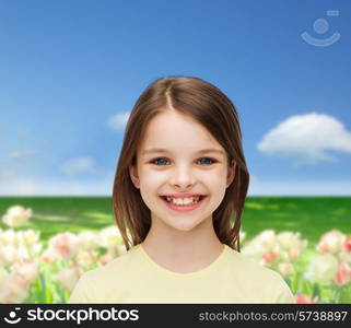 happiness and people concept - smiling little girl over white background