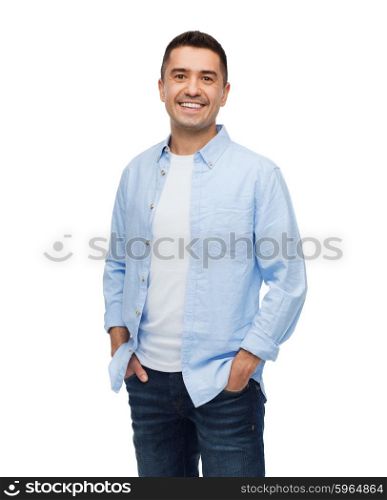 happiness and people concept - smiling man with hands in pockets. smiling man with hands in pockets