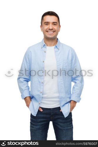 happiness and people concept - smiling man with hands in pockets. smiling man with hands in pockets