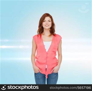 happiness and people concept - smiling teenage girl in casual clothes over blue laser background