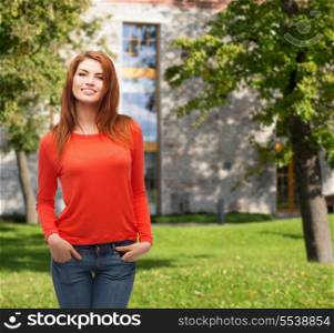 happiness and people concept - smiling teenager in casual top and jeans at campus