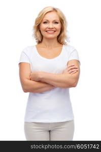 happiness and people concept - smiling woman in blank white t-shirt with crossed arms. smiling woman in blank white t-shirt