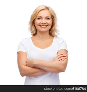 happiness and people concept - smiling woman in blank white t-shirt with crossed arms. smiling woman in blank white t-shirt