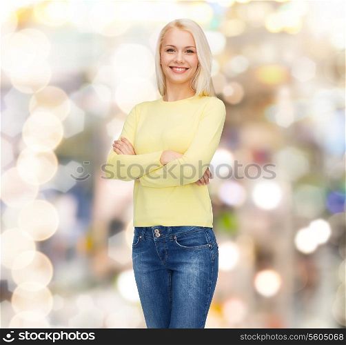 happiness and people concept - smiling young woman in casual clothes
