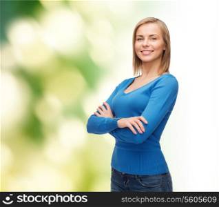 happiness and people concept - smiling young woman in casual clothes