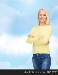 happiness and people concept - smiling young woman in casual clothes