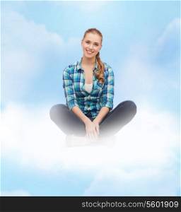 happiness and people concept - smiling young woman in casual clothes sitting on floor
