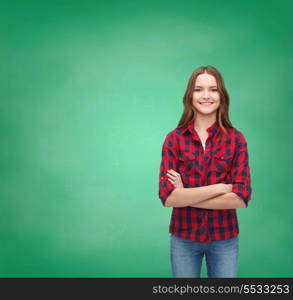 happiness and people concept - smiling young woman in casual clothes with crossed arms