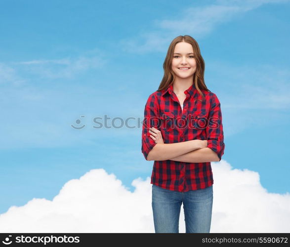 happiness and people concept - smiling young woman in casual clothes with crossed arms