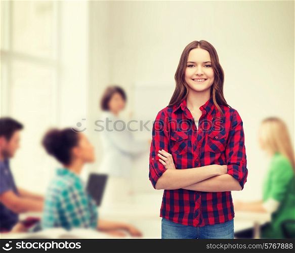 happiness and people concept - smiling young woman in casual clothes with crossed arms