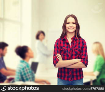 happiness and people concept - smiling young woman in casual clothes with crossed arms