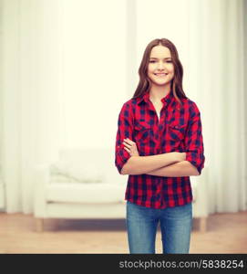 happiness and people concept - smiling young woman in casual clothes with crossed arms