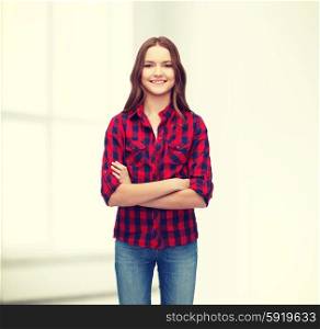 happiness and people concept - smiling young woman in casual clothes with crossed arms. smiling young woman in casual clothes