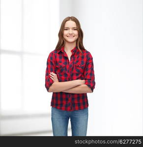 happiness and people concept - smiling young woman in casual clothes with crossed arms