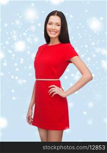 happiness and people concept - smiling young woman in red dress