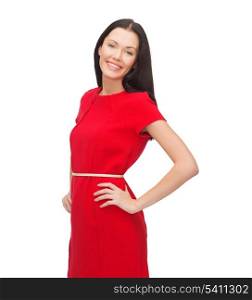happiness and people concept - smiling young woman in red dress