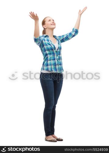 happiness and people concept - smiling young woman waving hands