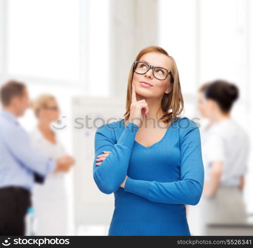 happiness, business, office and people concept - happy smiling young woman in black eyeglasses dreaming