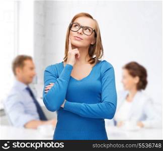 happiness, business, office and people concept - happy smiling young woman in black eyeglasses dreaming