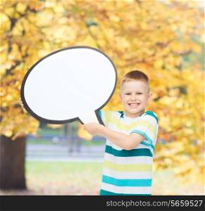 happiness, child, conversation and people concept - smiling little boy with blank text bubble over autumn park background