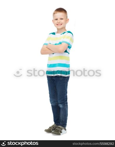 happiness, childhood and people concept - smiling little boy in casual clothes with crossed arms