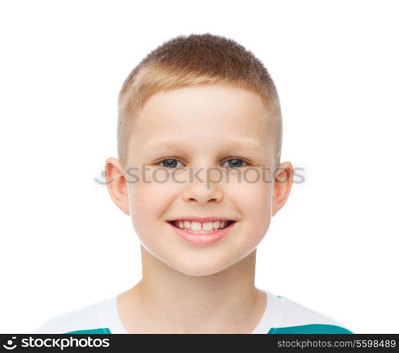 happiness, childhood and people concept - smiling little boy over white background
