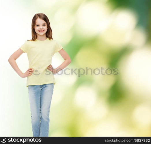 happiness, childhood and people concept - smiling little girl in casual clothes