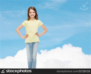 happiness, childhood and people concept - smiling little girl in casual clothes