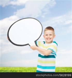 happiness, childhood, conversation, environment and people concept - smiling little boy with blank text bubble over natural background