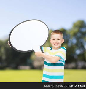 happiness, childhood, conversation, nature and people concept - smiling little boy with blank text bubble over green park background