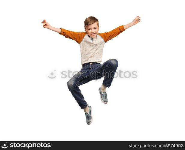 happiness, childhood, freedom, movement and people concept - happy smiling boy jumping in air