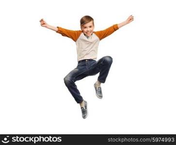 happiness, childhood, freedom, movement and people concept - happy smiling boy jumping in air